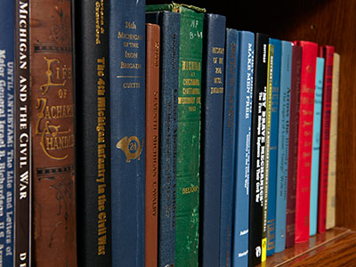 Bookshelf image of titles relating to Michigan's experience in the Civil War. Shot for Look Around You Ventures LLC by William Eichler. Copyright 2014.